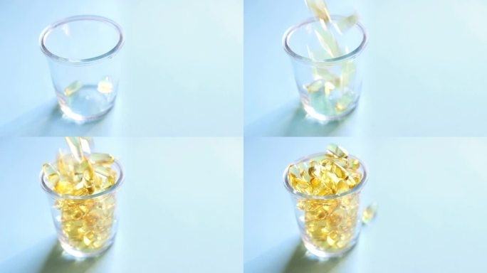 含有维生素的透明黄色胶囊被倒入蓝色背景的透明玻璃杯中。鱼油补充剂。健康、维生素和药物的概念。欧米茄3