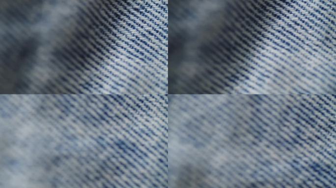 蓝色牛仔裤面料特写。牛仔纹理，抽象背景