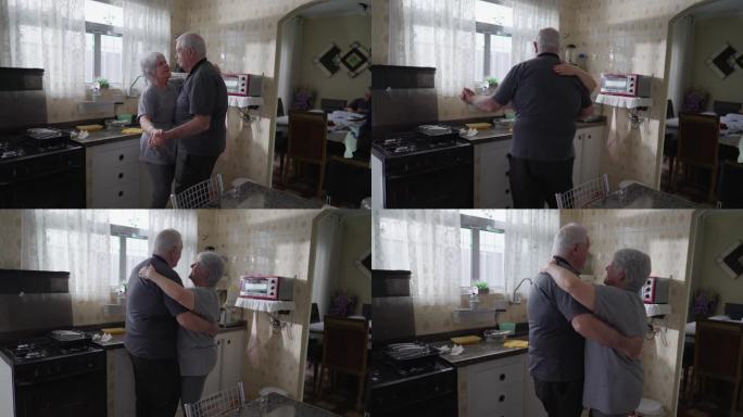 老年夫妇在厨房跳舞，坦率浪漫的老年夫妻在亲密的爱的关系