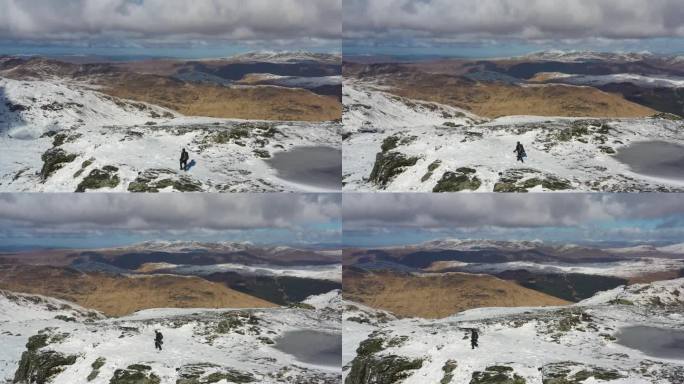 徒步旅行者登上苏格兰一座雄伟山脉的顶峰。
从洛蒙德湖的Ban Vane鸟瞰苏格兰高地的雪山。高山的观