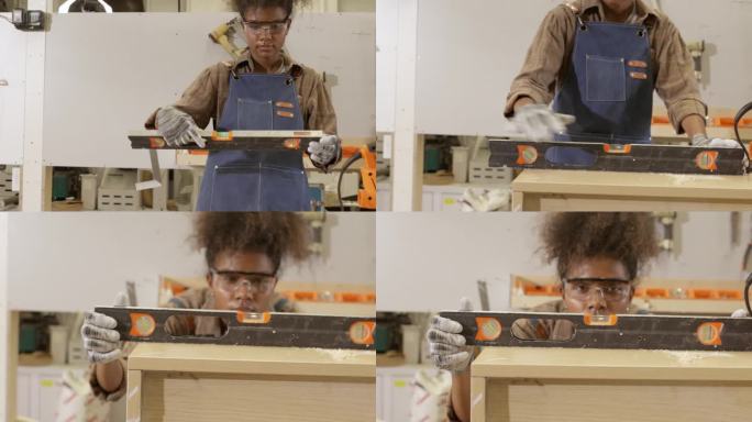 非洲年轻女木匠在工厂里用钢尺量角