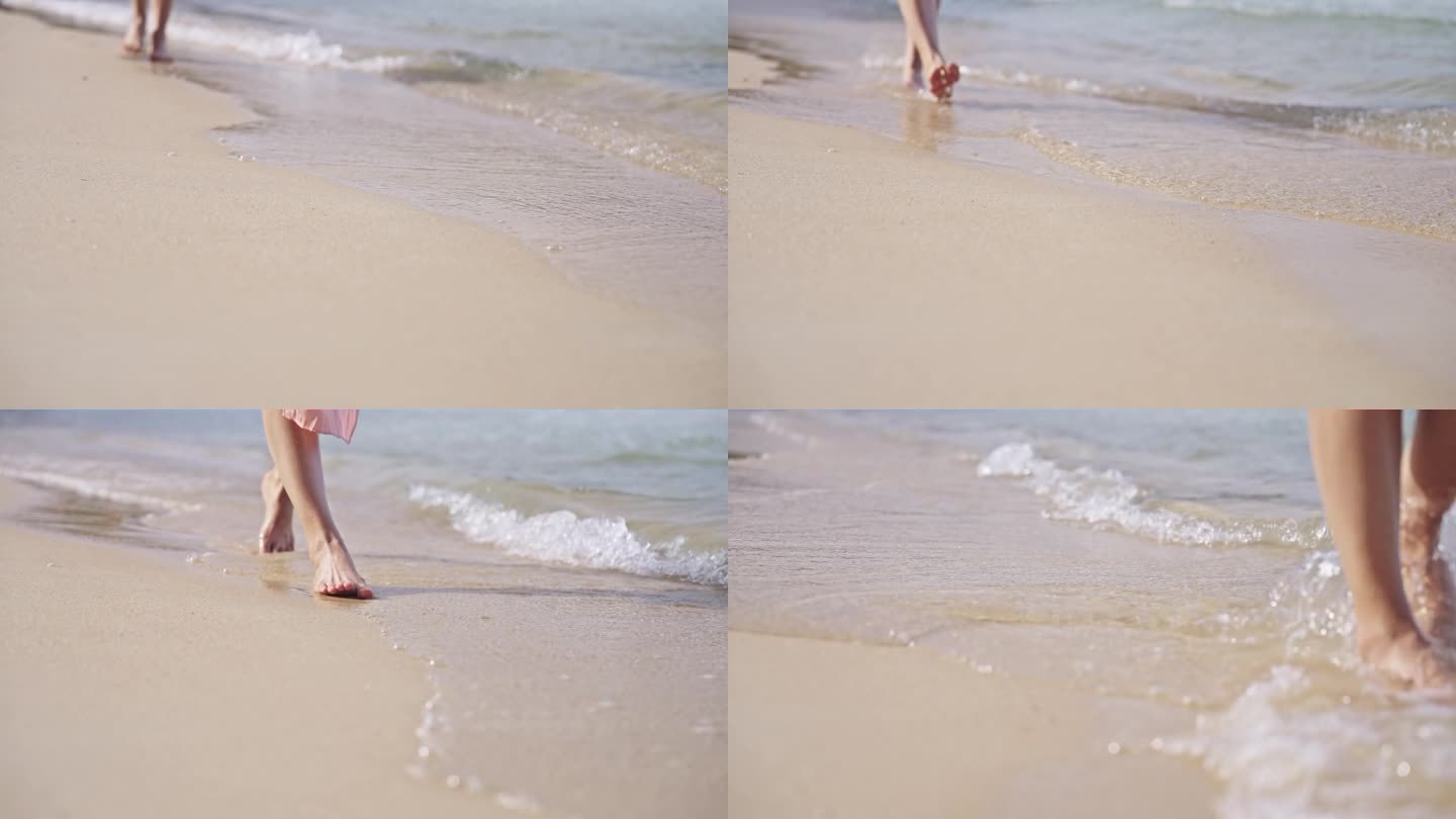 慢镜头镜头下的女人在沙滩上行走