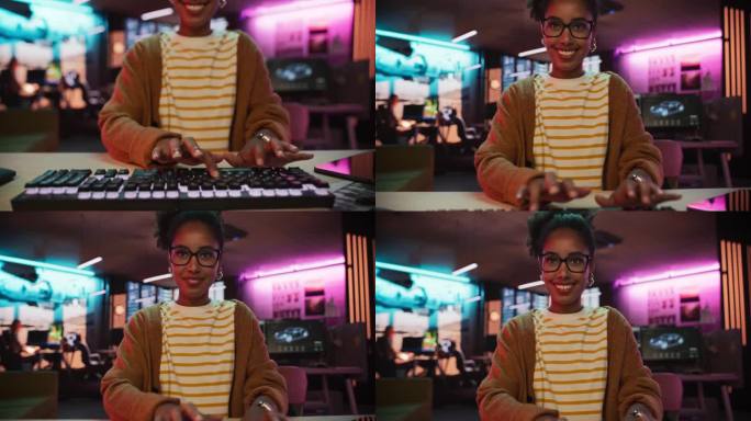 监视器屏幕POV:在创意机构中使用键盘和在台式电脑上打字的黑人女性。在一家广告公司从事创意工作的敬业