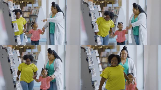 多种族母亲和两个女儿在图书馆散步