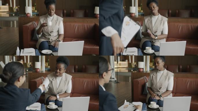 非裔美国女商人在酒店休息室喝咖啡，然后会见中东合作伙伴