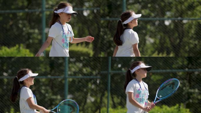 小女孩在球场上打网球，小女孩在球场上玩网球，小女孩在球场上玩网球，小女孩在球场上表演网球，小女孩在球