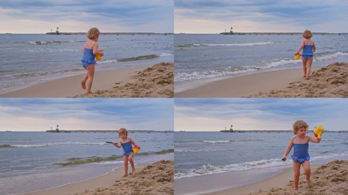可爱的白人小女孩穿着泳衣在沙滩上玩耍，从海边的海浪中奔跑