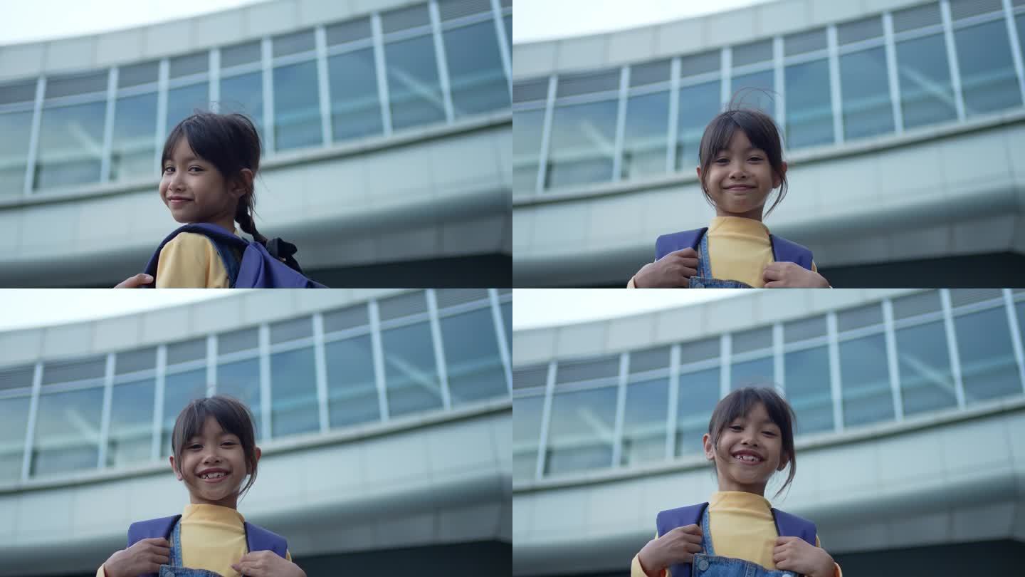 一个小女孩高兴地背着书包，去上学。