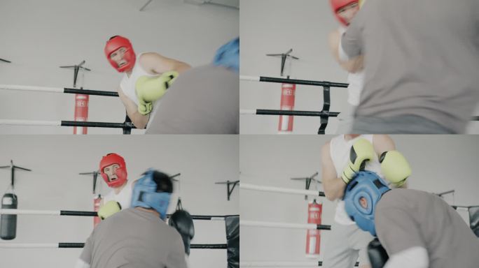 两名男子拳击搭档戴着手套和头盔在健身房训练