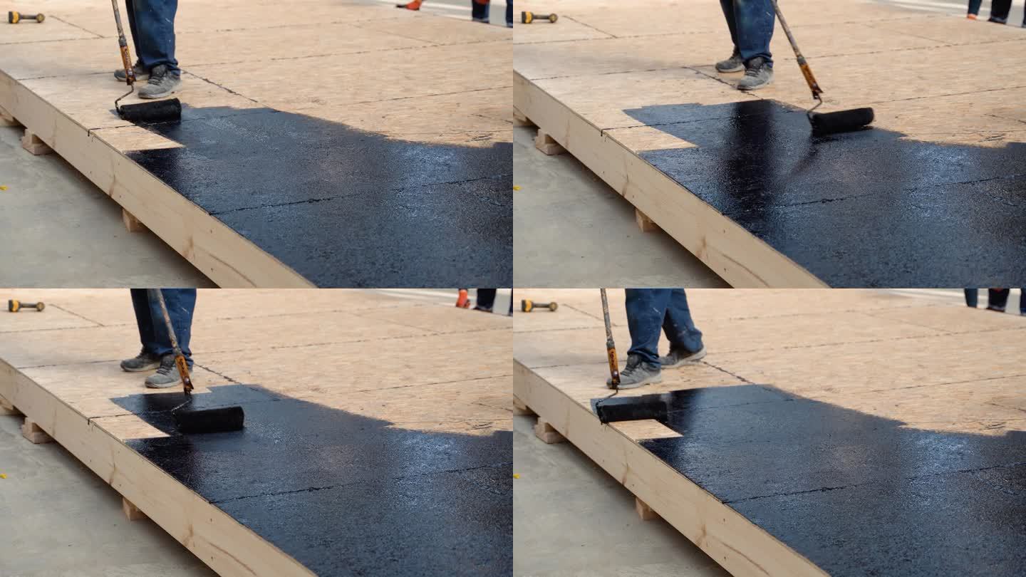 涂热树脂在地板上防水，涂树脂的滚筒和桶，涂黑色和液体树脂