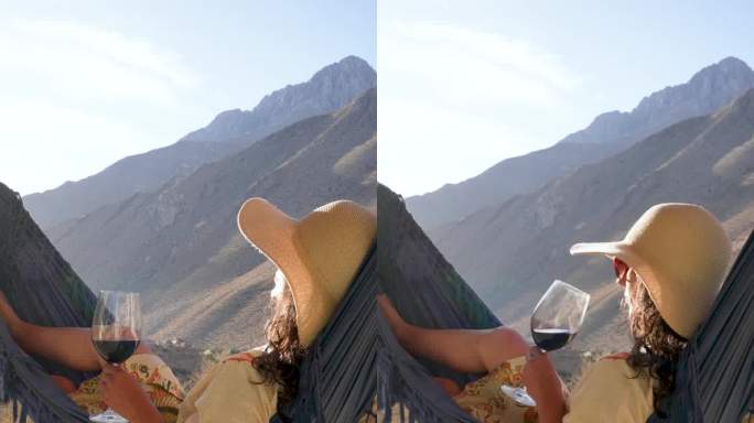 拉丁美洲妇女躺在吊床上喝着酒，看着日落放松