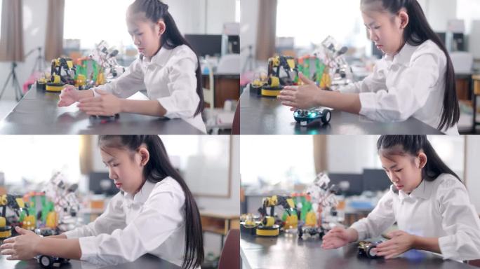 女学生在教室里组装机器人
