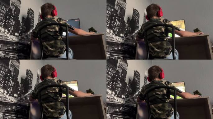 年轻的玩家在他的个人电脑上玩游戏。戴着耳机的男生在家玩网络游戏。在家玩游戏的概念。后视图。
