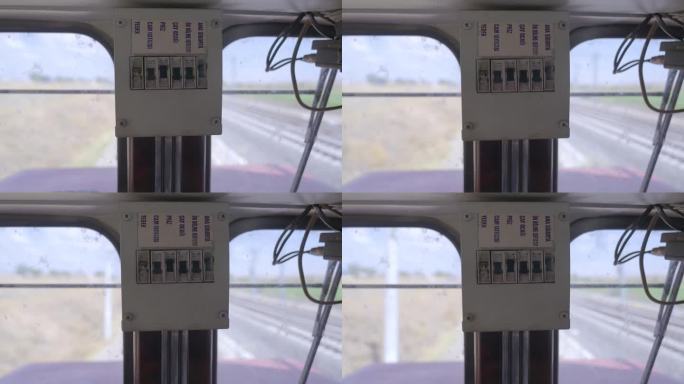 行驶中的火车车头的4K镜头。铁路工程师库存视频室断路器。