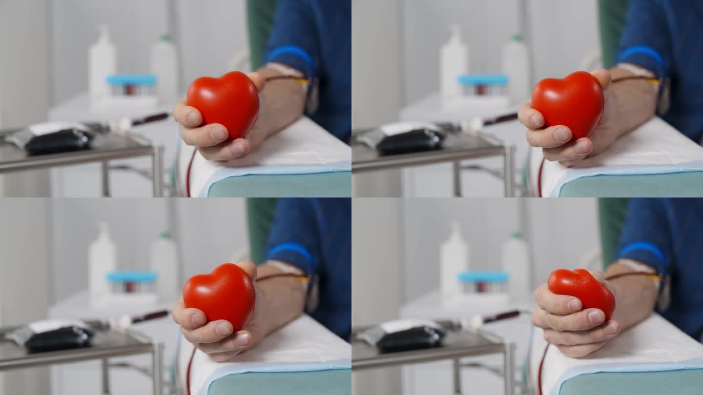 献血者在献血时的特写，手里拿着有弹性的心脏球