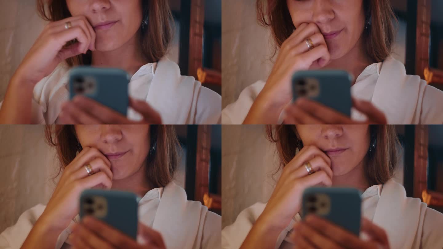 脸美丽专注的高加索女商人使用手机移动应用程序在蓝色的情况下思考，工作触摸嘴唇。
