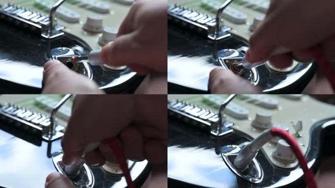 一名男子正在清洗装有白色拾音器的黑色电吉他。吉他服务理念。4k视频片段