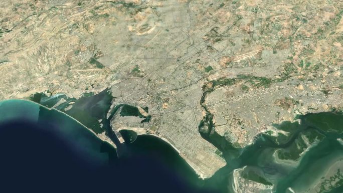 卫星卡拉奇地图背景循环。巴基斯坦城市上空盘旋的画面。无缝全景旋转在市中心的背景。