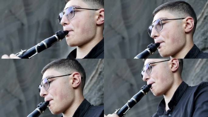 一个中东的单簧管少年，戴着眼镜，梳着漂亮的发型，穿着黑色衬衫，在美丽的黑色岩石背景下演奏单簧管。