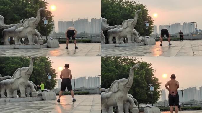 早晨阳光晨曦河堤江滨公园晨运的男子运动者