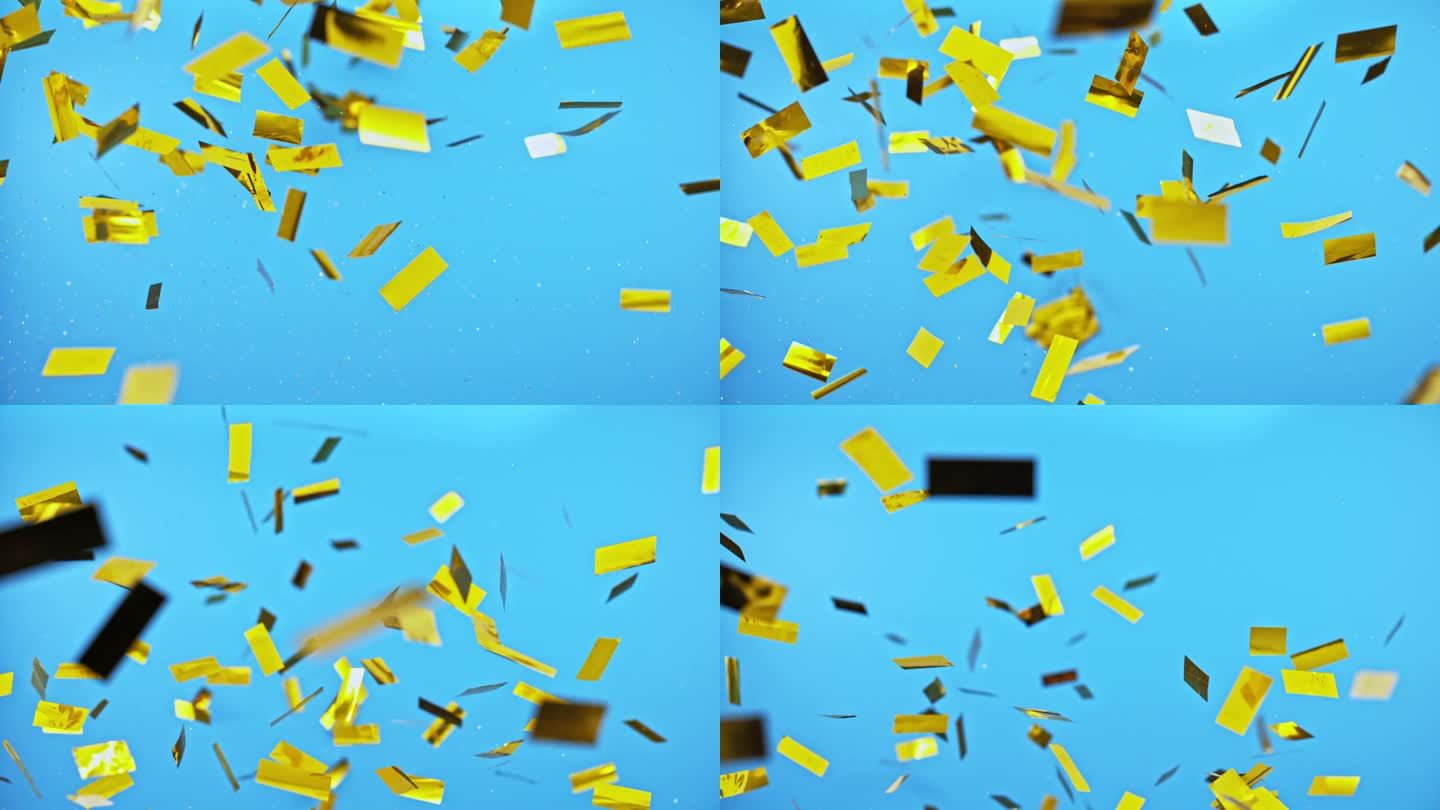 金色的五彩纸屑在空中飞舞，蓝色的背景