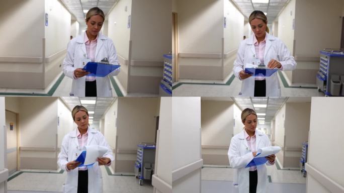 一位拉丁美洲的女医生在医院走廊上看病历