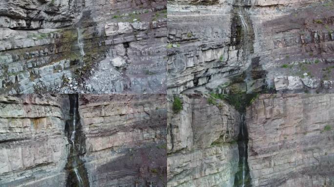 在科罗拉多州的奥雷，空中飞行着从悬崖上倾泻而下的高大瀑布