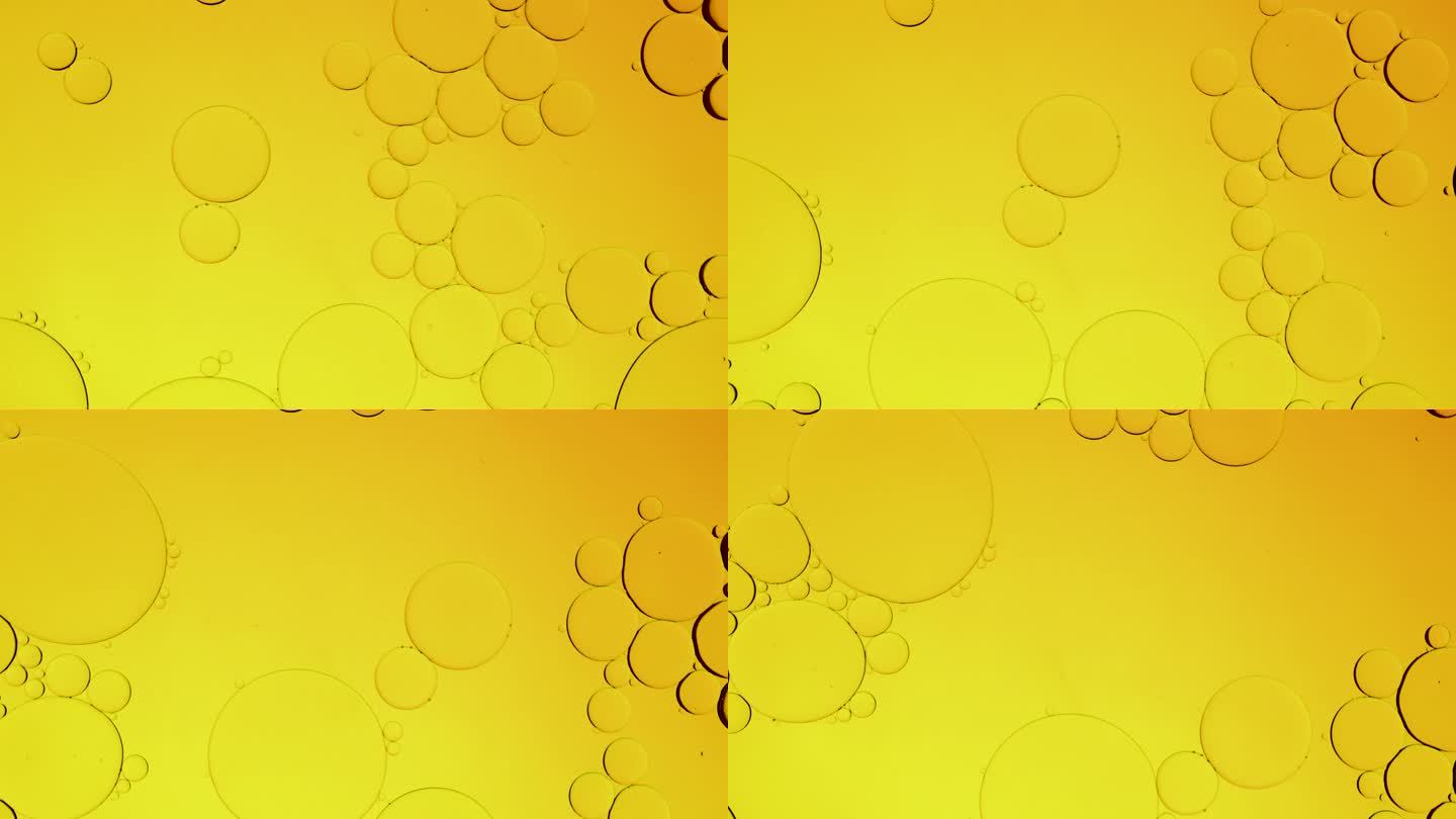 微距镜头，金黄冒泡油圆球水。气泡离得非常近。抽象智能手机主屏风格，主题背景，金色球体，震动震动爆炸，