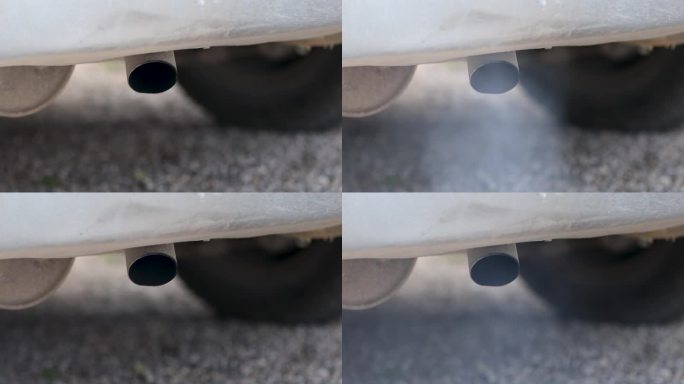柴油车发动机启动时排气管冒烟的特写
