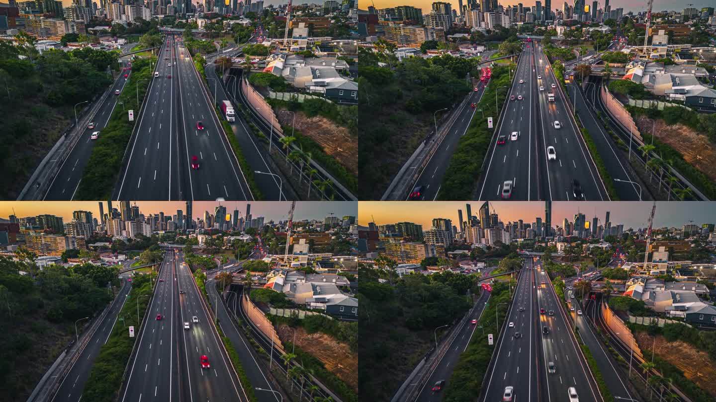 4K鸟瞰图澳洲昆士兰州布里斯班下班后晚上高速公路交通道路上的布里斯班市景