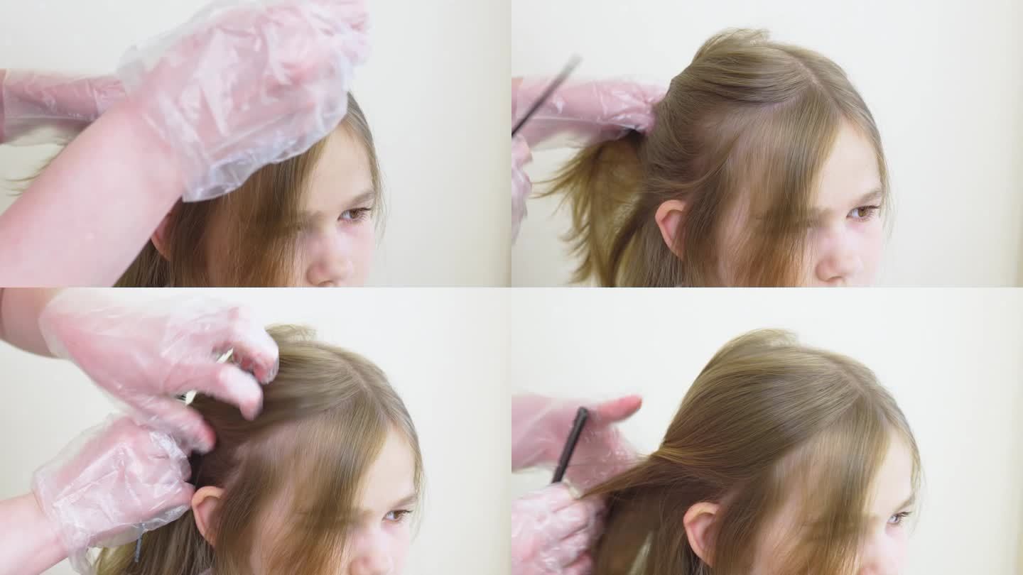 妈妈给女儿梳头，把头发分成几缕，以便突出。