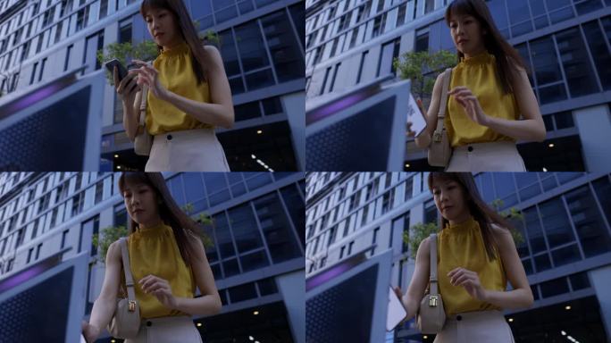 香港一名亚洲女性正在用手机支付停车费，她接受了数字钱包和多种支付方式的概念。