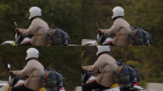 一名身穿米色夹克的骑手骑着经典和越野摩托车，带着包袱开始了一场冒险。当引擎嗡嗡作响时，风格与实用性相