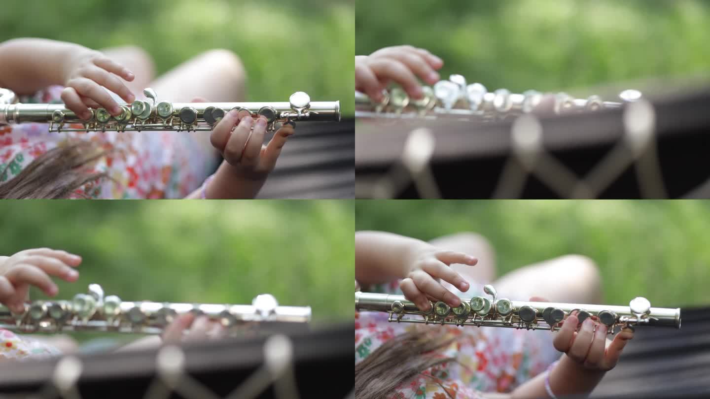 小女孩在吊床上演奏横笛