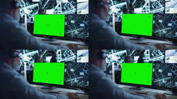 中年监控专家在绿屏模拟显示的电脑上工作。经理有效地多任务处理支持客户的电话和电脑工作