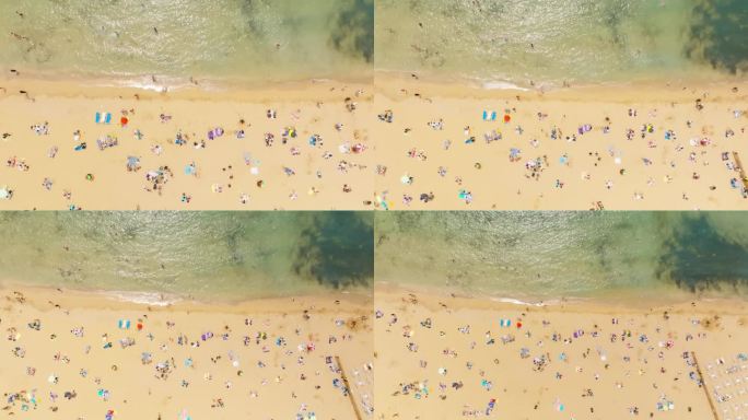著名的马耳他海滩鸟瞰图，黄金湾。海滩上的人们。马耳他岛