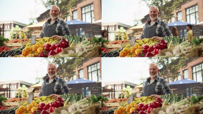 成功的老农民摆姿势和愉快地微笑相机。有胡子的中年男子在他的街头摊档上出售农产品和可持续有机水果和蔬菜