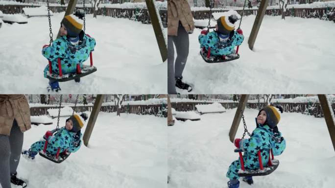 在冬天的公园里，一个快乐微笑的小男孩在雪地里荡秋千。寒假里的欢乐，孩子们在户外玩耍，在雪中活动