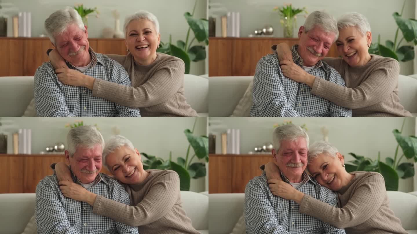 成年夫妇在家里拥抱。中年老夫老妻温柔地拥抱在一起，享受甜蜜的幸福。奶奶爷爷在一起。亲情时刻的爱和关怀