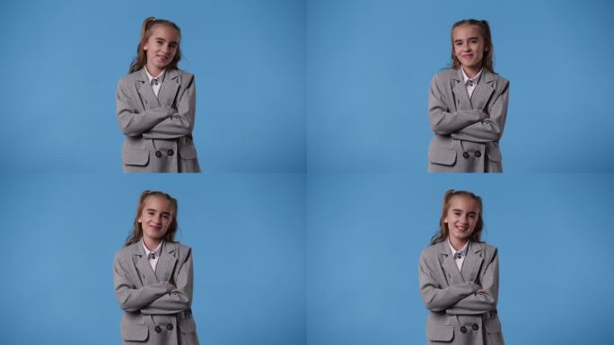 可爱女孩微笑的4k视频，蓝色背景。
