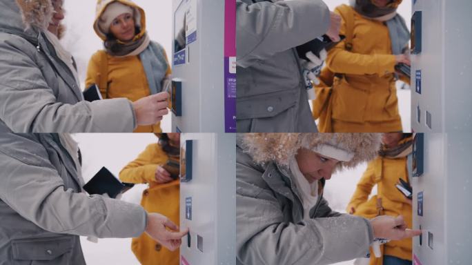 一名妇女用信用卡在自动售货机前进行非接触式付款