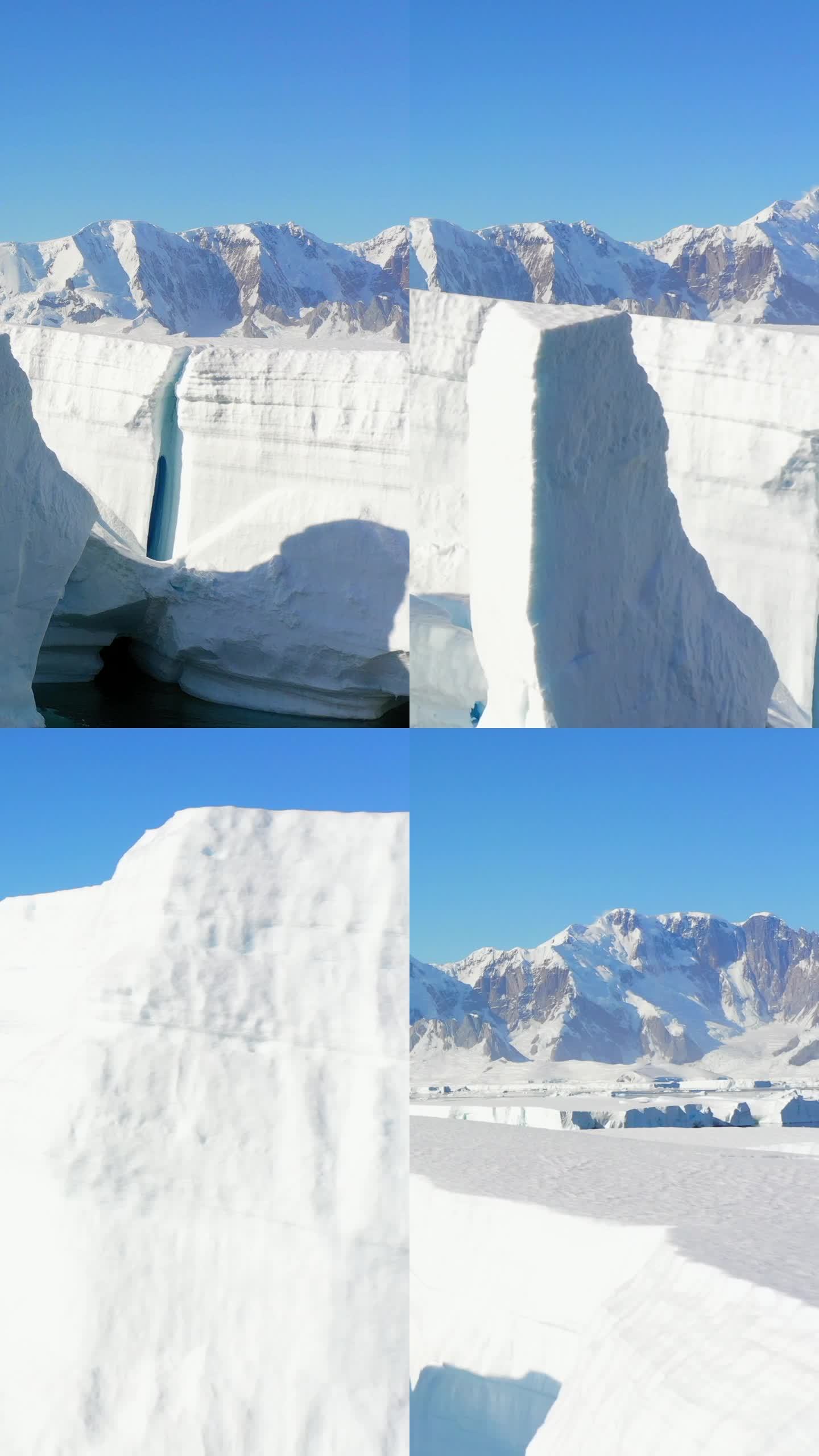 垂直镜头巨大的冰山和浮冰的背景雪山。