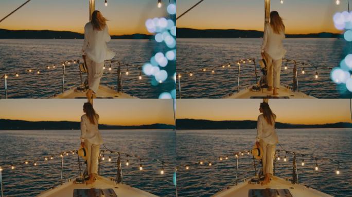 美丽时尚的女人站在船上，戴着太阳帽，欣赏海景