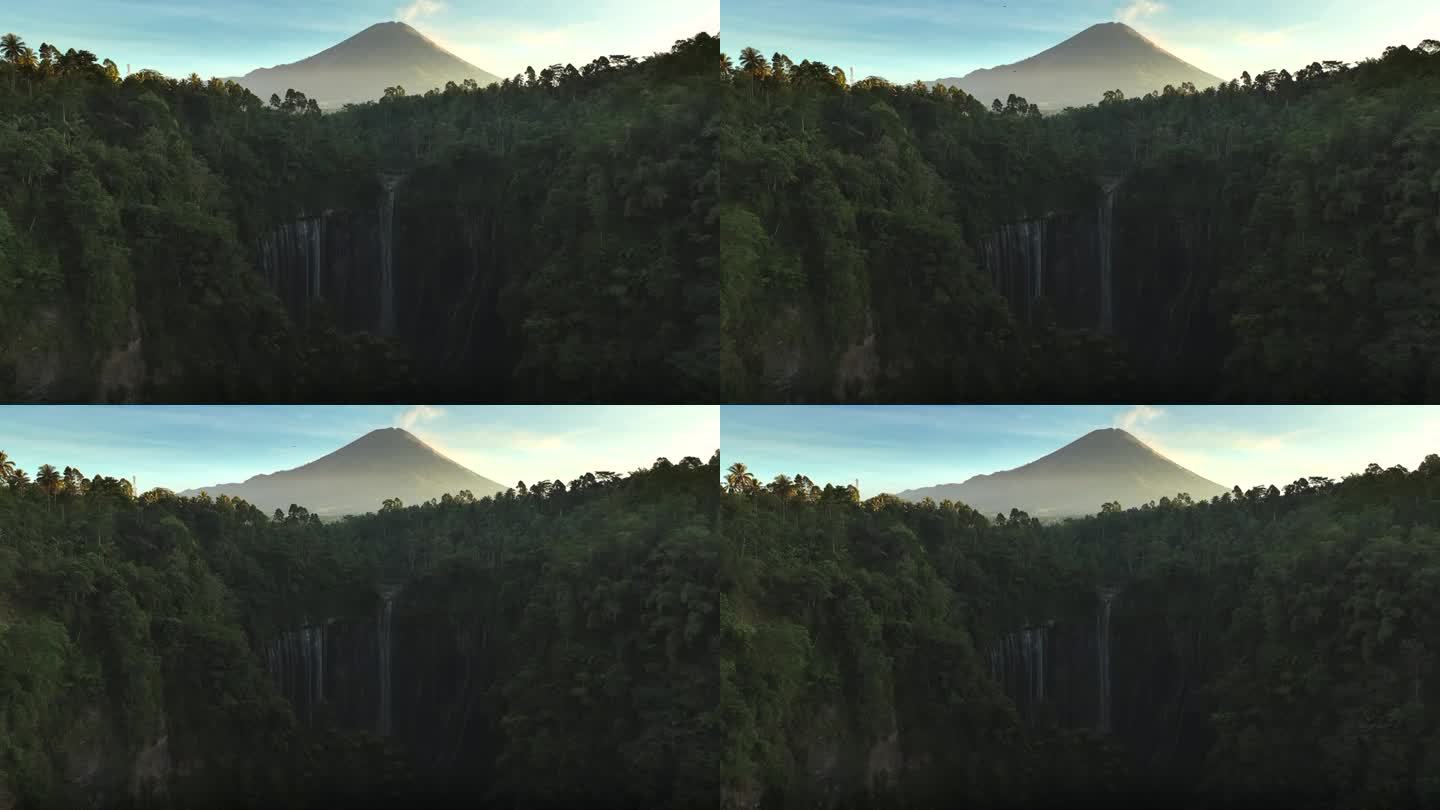 风景秀丽的鸟瞰图日出的图姆帕克塞乌瀑布与塞默鲁火山背景丛林在爪哇岛，印度尼西亚