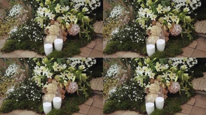 婚礼用鲜花组成的鲜花。美丽的插花与白色的菊花和绿色植物，慢动作拍摄。