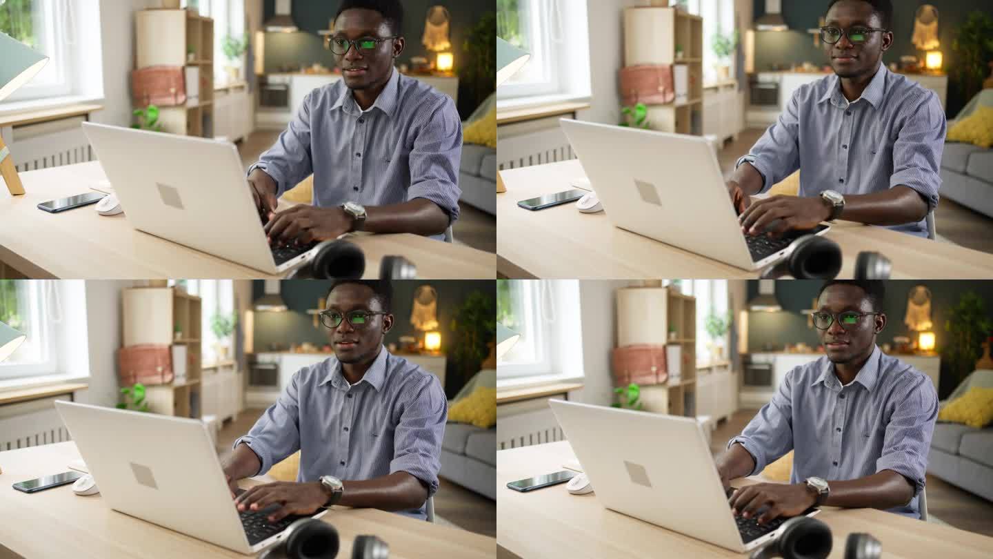 非裔美国男性学生在使用笔记本电脑时进行电子学习