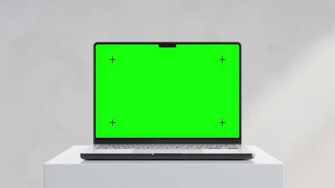 现代笔记本电脑模型，绿色屏幕，极简主义的设置，坐在一个白色的底座，小车和停止相机运动