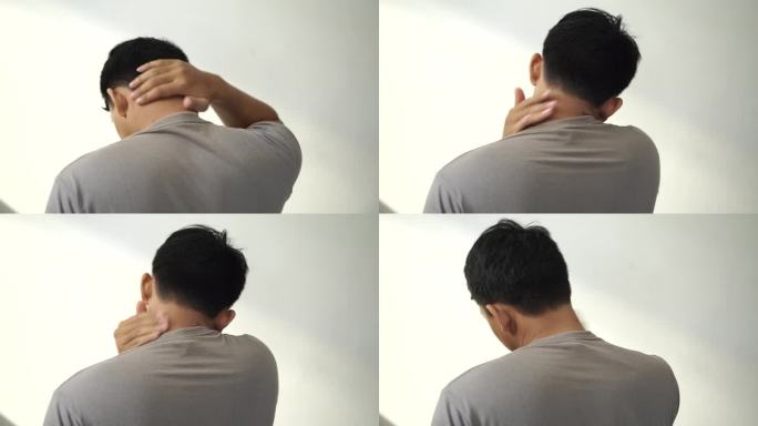 一个亚洲年轻人因为皮肤发痒而抓挠脖子