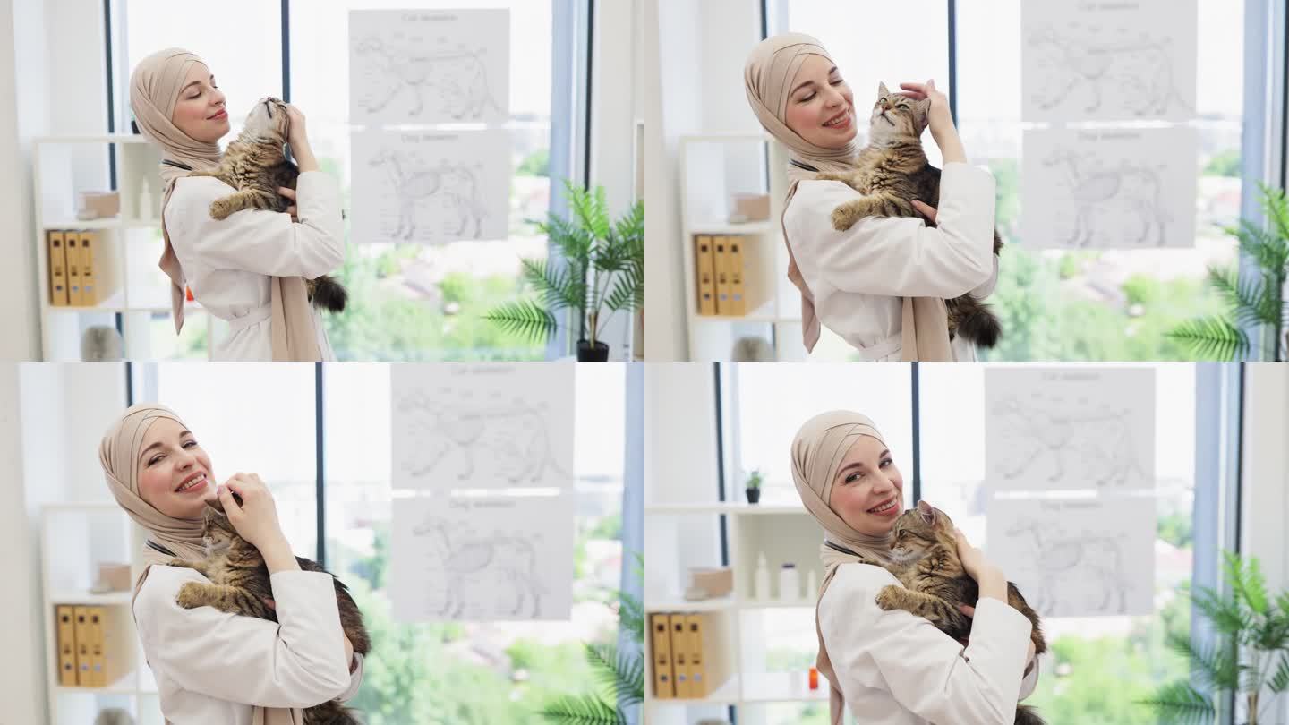 一位阿拉伯女士站在宠物护理中心，手里抱着猫