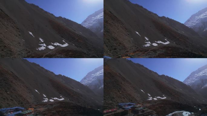 航拍照片显示徒步旅行者在喜马拉雅山脉山顶的建筑物。在提里科大本营徒步旅行。住宿宾馆建筑，旅游理念。